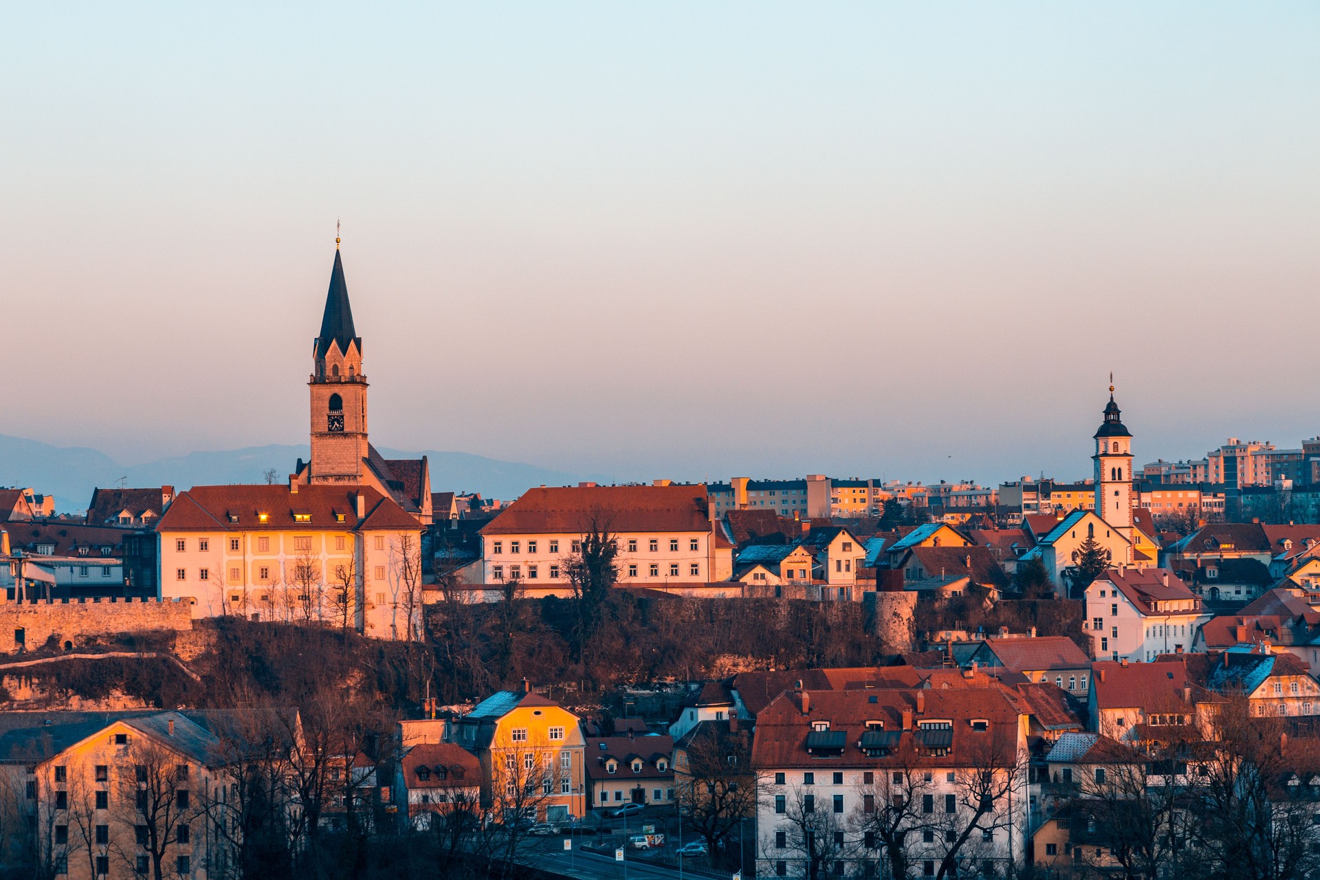 The city of Kranj at sunset where two famous churches, Catholic and Orthodox, are visible